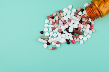 many pills with green background