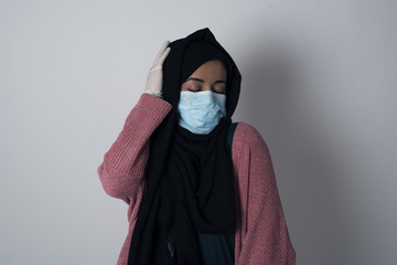 Shot of happy young woman with positive smile, has long hair, rejoices having weekend and good rest after hard working exhausting week, isolated on gray wall.