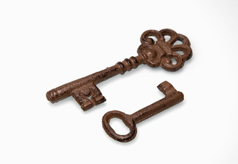 Two old keys on a white background