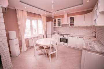 Kitchen interior the room, modern kitchen, a kitchen background, the concept of healthy food, an interior of modern kitchen in beige, brown and white tones with a white brick