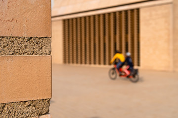 VADUZ, LIECHTENSTEIN - MARCH 28, 2020: two-wheeled cyclists drive past the Parliament building in...