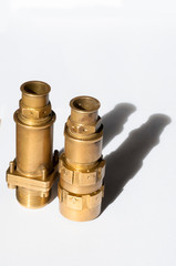 Brass four-pin electrical connector.