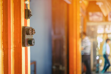 Close up to a very old light electric retro switch on on a wooden board. Vintage switch, Selective focus