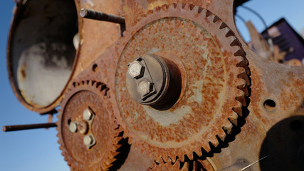 Old rusty gears - part of agricultural machinery