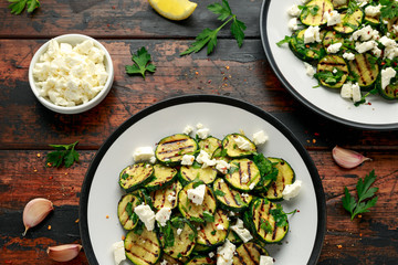 Warm salad with grilled zucchini, garlic and herbs