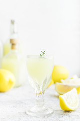 Italian traditional liqueur limoncello with thyme