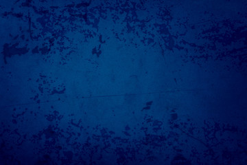 Fototapeta premium Blue background with grunge texture, old vintage rusted metal with peeling paint , abstract scratched grungy damaged paper or wall in dark phantom blue