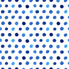 Seamless pattern with blue polka dots of different shades/ Hand drawn design element/ Abstract background
