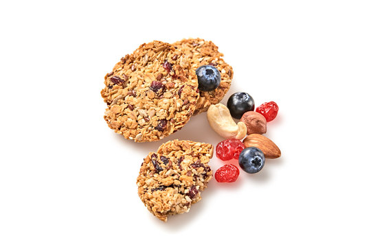 Granola Bar Cookie With Nuts And Dry Fruit Berries. Energy Cereal Healthy Homemade Snack. Diet Nutrition. Muesli Bars Isolated On White Background. Oatmeal Cookie Closeup