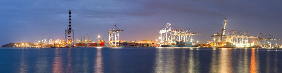 Obraz premium Transportation and Shipping Logistics Loading Dock Terminal., Container Import and Export of Sea Freight Transport Industrial., Landscape of Port Maritime and Harbor Cargo Shipyard With Crane Bridge.