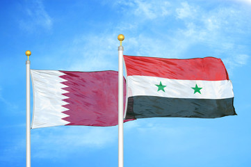 Qatar and Syria two flags on flagpoles and blue cloudy sky