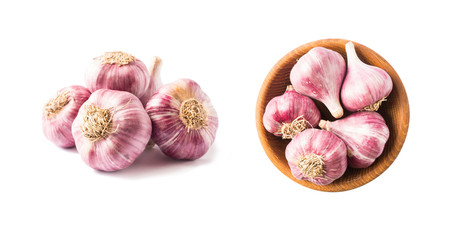 Garlic isolated on white background. Garlic Isolated on white background Clipping Path. Garlic press and garlic on white background. Top view. Garlics from different angles on white.