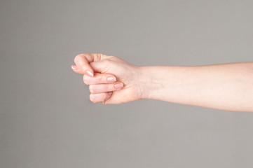 Fico gesture of a hand on a white background