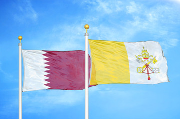Qatar and Vatican two flags on flagpoles and blue cloudy sky