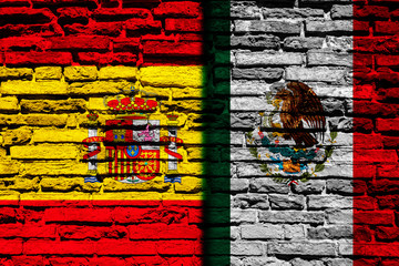 Flag of Spain and Mexico on brick wall