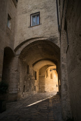 Fototapeta na wymiar Italian medieval yard of the european city with beautiful exterior house and square