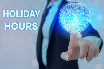 Writing note showing Holiday Hours. Business concept for employee receives twice their normal pay...