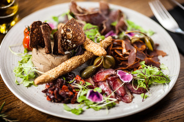 Meat platter for two served on a plate in restaurant
