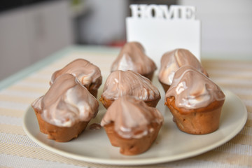 Still life homemade muffin with creamy chocolate top. Homemade quarantine baked goods.