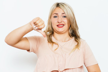 Woman showing a thumb down gesture
