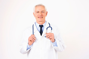 Senior male doctor studio portrait at isolated white background