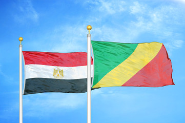 Egypt and Congo  two flags on flagpoles and blue cloudy sky