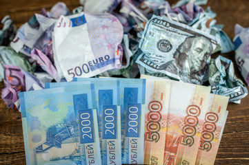 rubles and euros together, dollars in the background