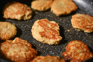 Fried potato pancakes in a pan. Potato pancakes.