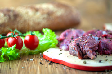 appetizing fresh meat with spices on a cutting Board