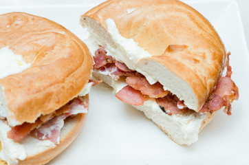 A selection of various sandwiches and fillings, garnished with crisps and salad.