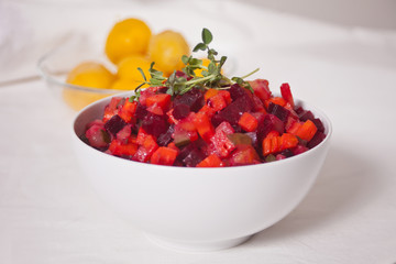 Russian vinaigrette beetroot salad on the white bowl.