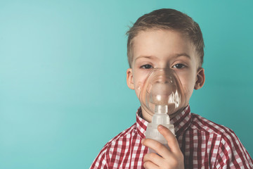 Inhalation child infant under five year. Boy making inhalation with nebulizer at home - obrazy, fototapety, plakaty