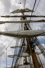 Folded sails on the mast of a sailing ship