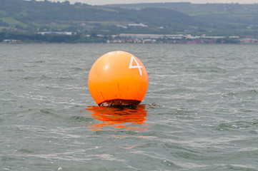 Orange buoy with the number 4 in Belfast Lough