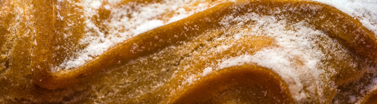 Panoramic view of ecler cakes with powdered sugar