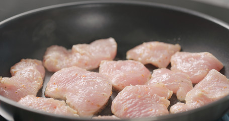 turkey fillet pieces frying on nonstick pan