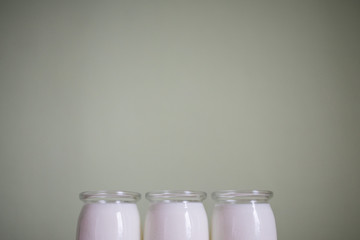 simplicity in design and eco-friendly packaging: glass jars with a dairy product
