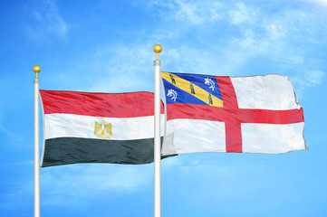 Egypt and Herm two flags on flagpoles and blue cloudy sky