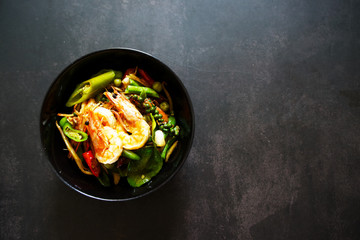 Top view Stir fried shrimp on dark gray background, thai famous food background concept 