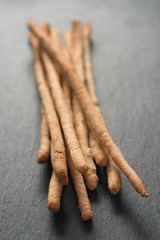 Traditional italian snack - grissini on concrete surface