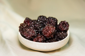 black dates in a bowl
