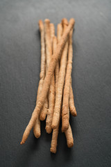 Traditional italian snack - grissini on concrete surface