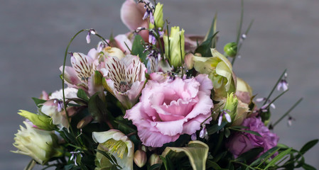 beautiful bouquet of delicate flowers on a gray background