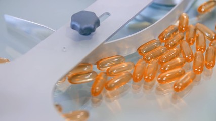 Transparent orange-yellow pills for coronavirus outbreak during counting process - Powered by Adobe