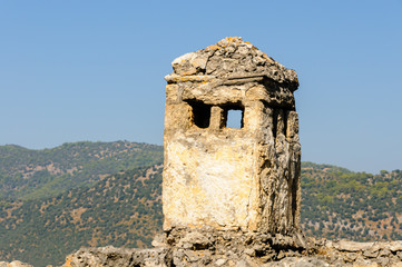 Ruins at the former Greek village of Kayakoy in Turkey, abandoned 1922, now a museum and also known...