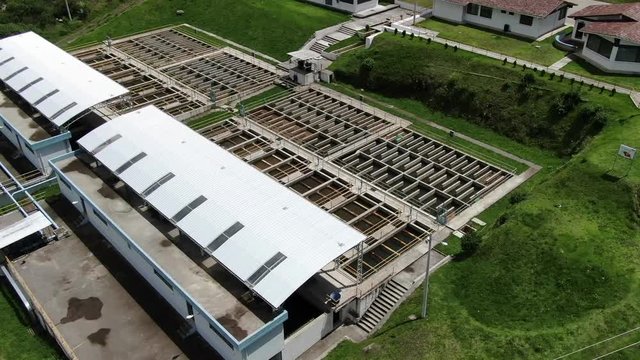 Aerial top view recirculation solid contact clarifier sedimentation tank, Water treatment plant Papallacta