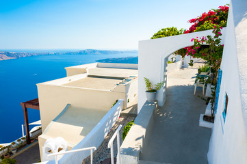 Fototapeta na wymiar White architecture and blue sea on Santorini island, Greece. Summer holidays, travel destinations concept