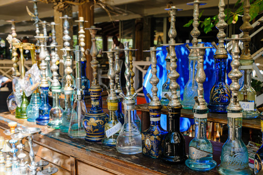 Shisha pipes on a shelf in the Hookah Lounge of a Turkish restaurant.