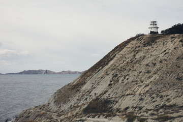 lighthouse on a rock by the sea