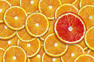 sliced orange texture background. natural orange background. slice of grapefruit on a background of...